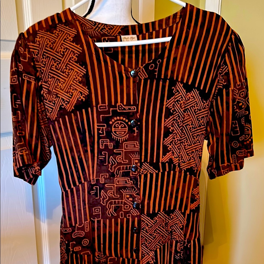 NWOT. Never worn, this beautifully printed dress is made in Bali.